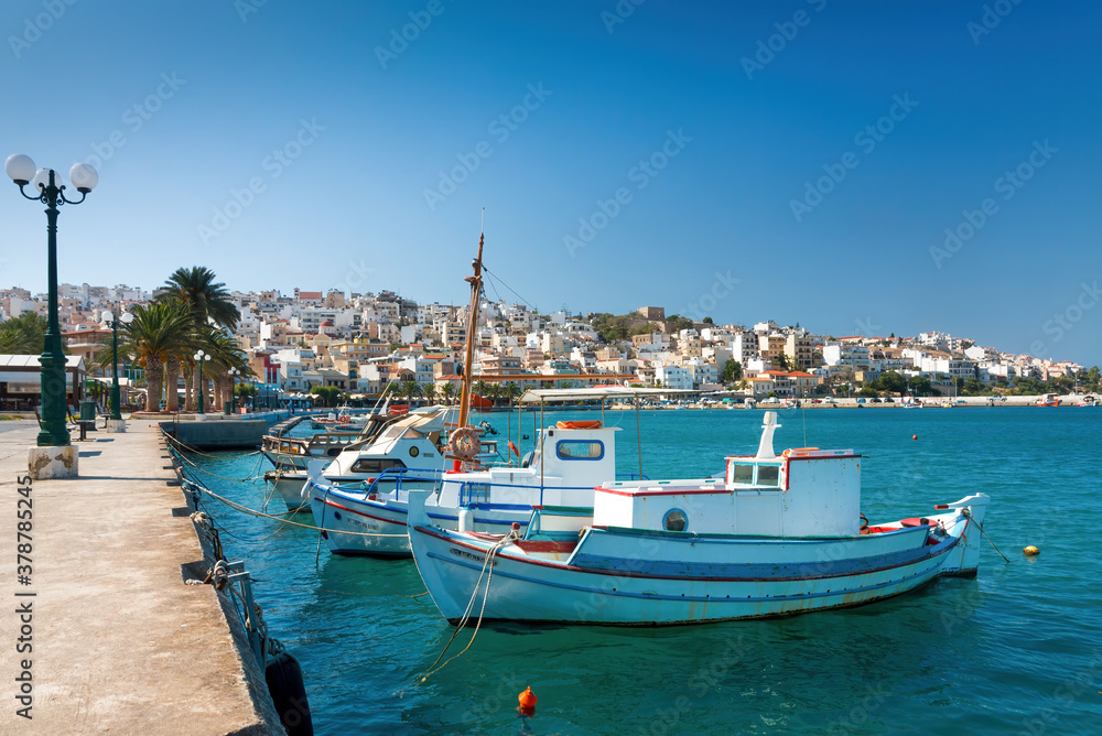 Sitia, Crete, Greece; August 27, 2020 - Seaport of Sitia town with moored traditional Greek fishing boats, Crete, Greece.