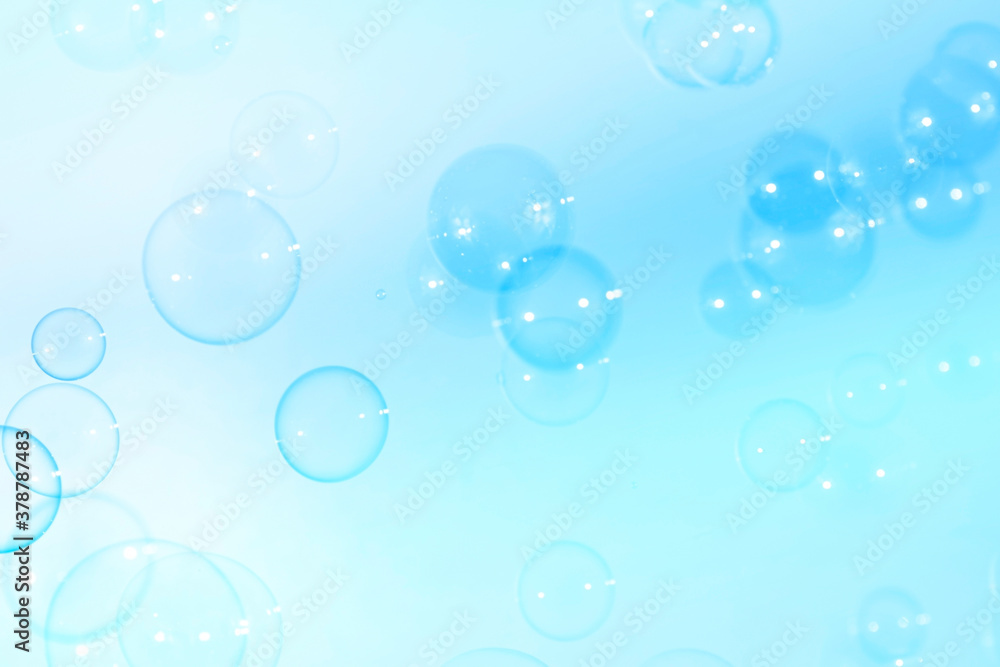 Fresh blue soap bubbles natural background.