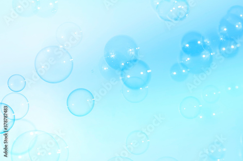 Fresh blue soap bubbles natural background.