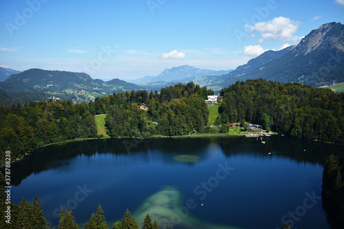 Fototapeta Naklejka Na Ścianę i Meble -  a top view of green lake Freibergsee at Alp mountains near Oberstdorf