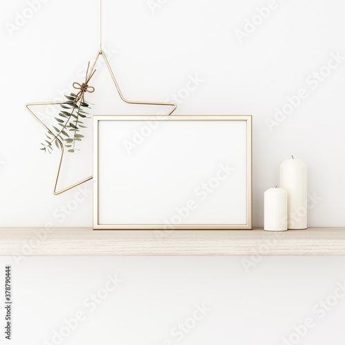 Horizontal frame mockup with gold matal star, eucalyptus, pine cones and candles on empty white wall background. Minimalist Christmas interior decoration. A4, A3 format. 3d rendering, illustration