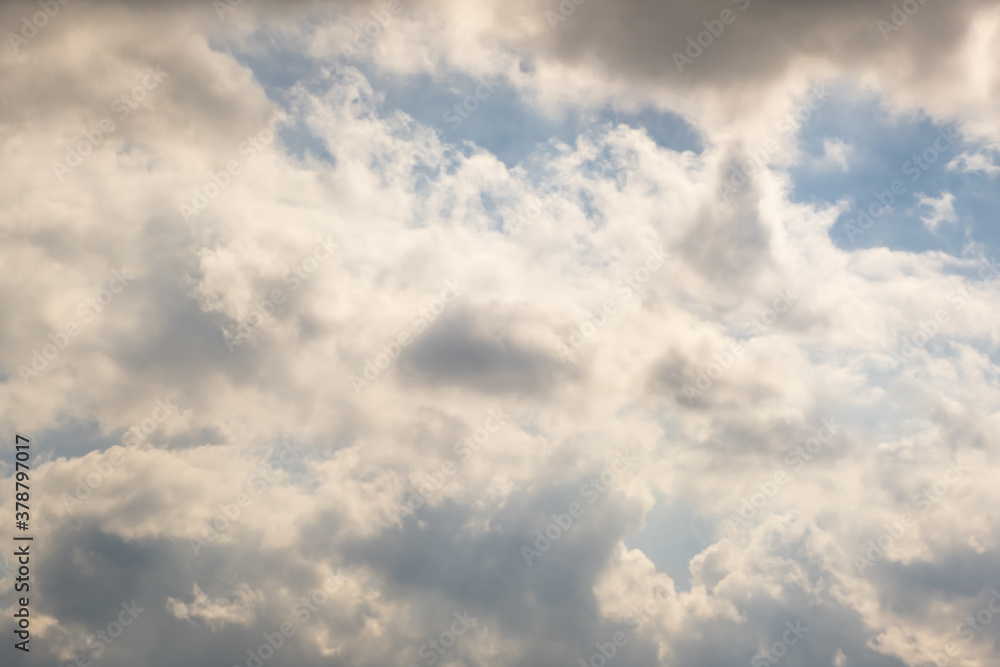 Blue sky background with white striped clouds. Clearing day and Good windy weather
