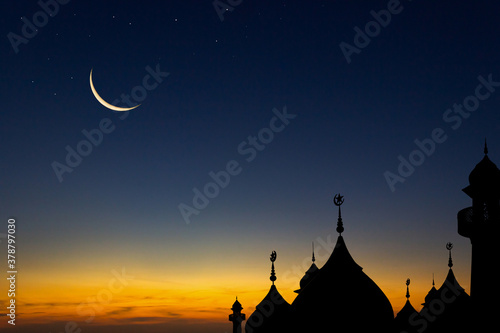 silhouette mosques dome on dusk sky and crescent moon star  