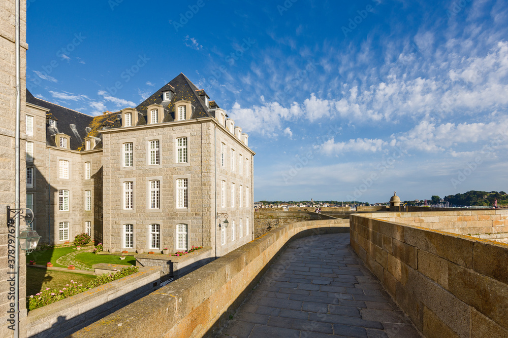 Waterfront view of beach townhouses and skyline, Saint-Malo, Brittany, France