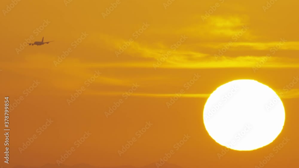 A captuviating Sunset on Dubai skyline with magnificent yellow and orange colors as the commercial plane approach the horizon. A captuviating Sunset on Dubai skyline with magnificent yellow and orange colors as the commercial plane approach the horizon.