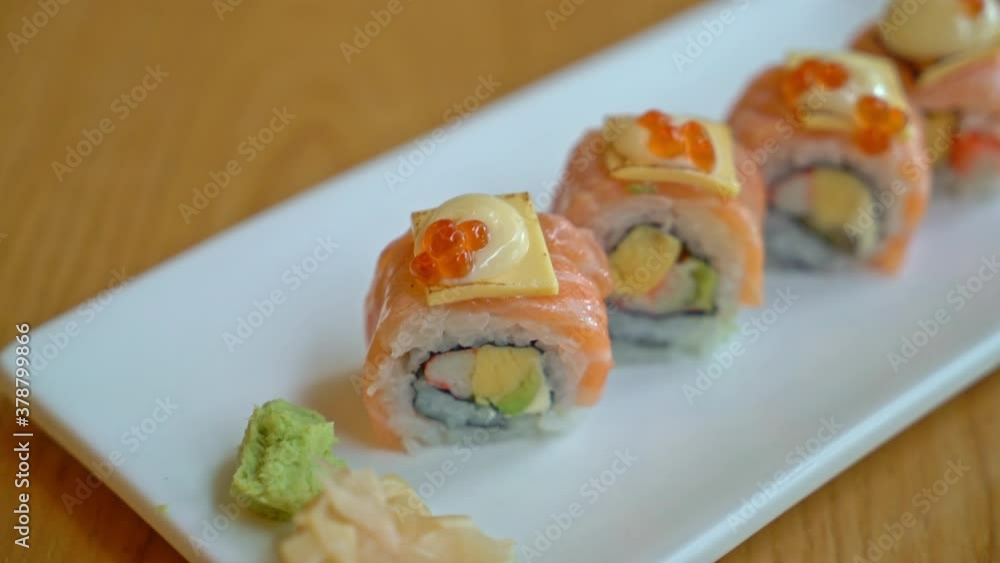 salmon roll sushi with cheese on top - Japanese food style salmon roll sushi with cheese on top - Japanese food style