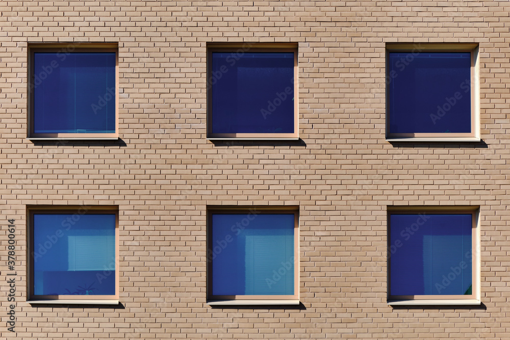 The blue windows in the brick wall. Modern Nordic architecture.