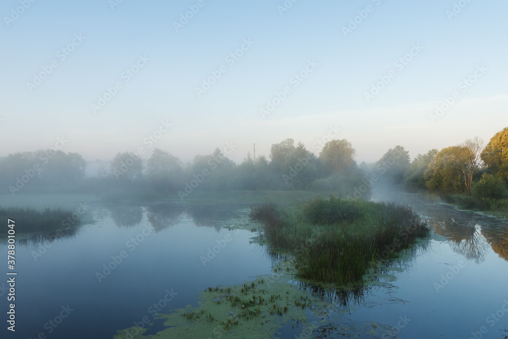 Morning fog over the river. Dawn