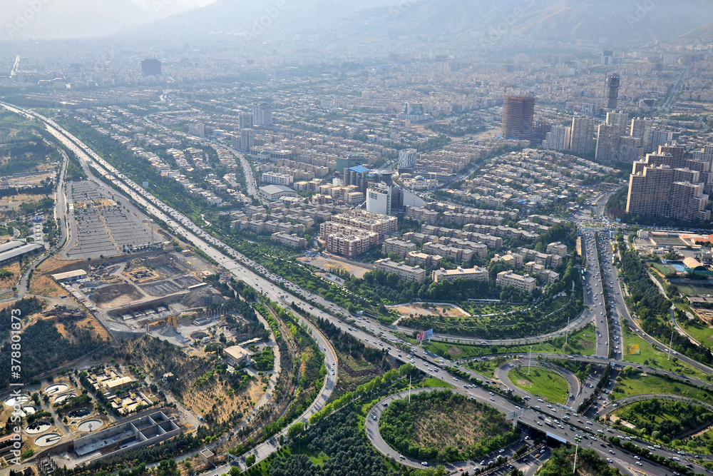 Fototapeta premium View of the city, highway and surrounding houses from the Milad Tower (Borj-e Milad) in Tehran. Milad Tower is the most important monument of Tehran after the Azadi Monument.
