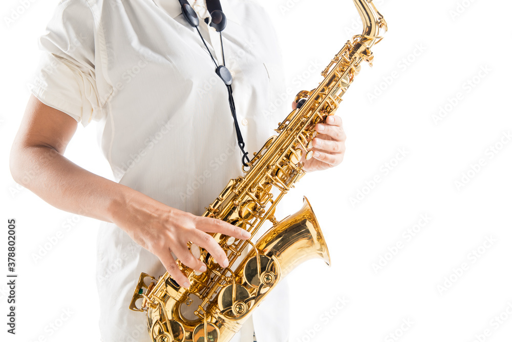 Naklejka premium Close up woman playing saxophone isolated on white studio background. Inspired musician, details of art occupation, world classic instrument for jazz and blues. Concept of hobby, creativity.