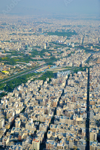 View of the city, highway and surrounding houses from the Milad Tower (Borj-e Milad) in Tehran. Milad Tower is the most important monument of Tehran after the Azadi Monument. Shadow of the tower.