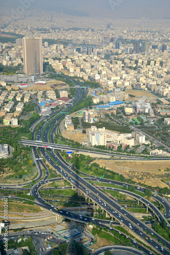 View of the city, highway and surrounding houses from the Milad Tower (Borj-e Milad) in Tehran. Milad Tower is the most important monument of Tehran after the Azadi Monument. Shadow of the tower.