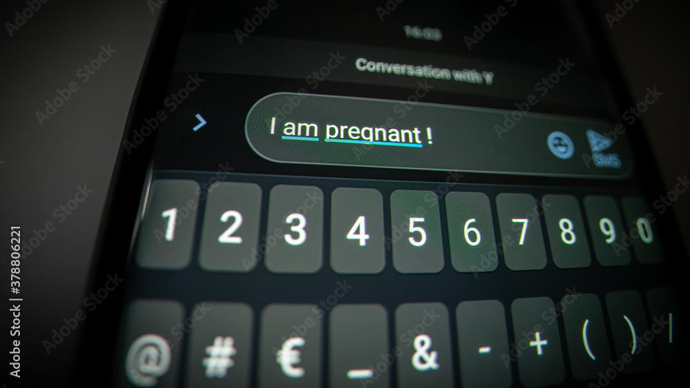 I am pregnant ! Close-up photography of device screen with focus on message text, visible pixels. I am pregnant ! Close-up photography of device screen with focus on message text, visible pixels.