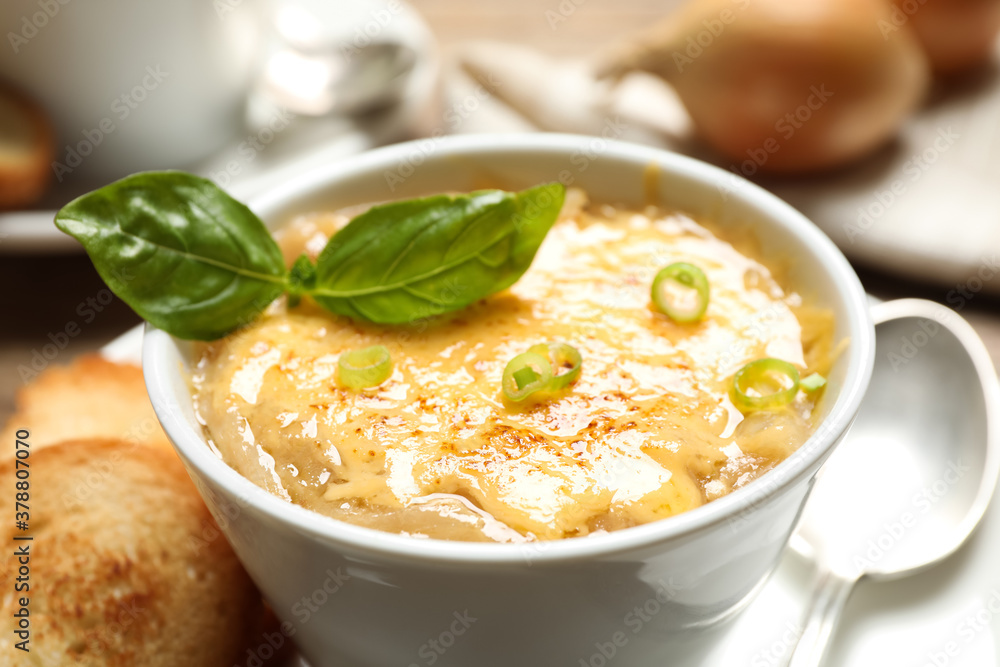 Tasty homemade french onion soup served is ceramic bowl, closeup Tasty homemade french onion soup served is ceramic bowl, closeup