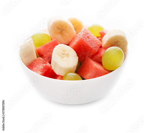 Fresh fruit salad on a plate, isolated on a white background
