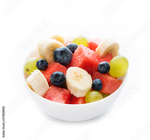 Fresh fruit salad on a plate  isolated on a white background