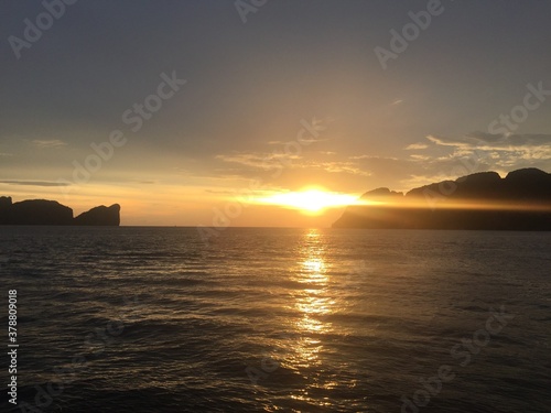 Extreme sunset view from the ocean in Thailand Phi Phi Islands Asia with mountains in the background 