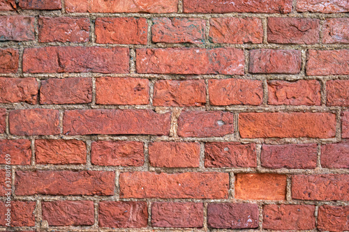 Old brick wall. Red brick wall. Panorama of the brickwork. The architectural background is brown. Pattern of bricks.