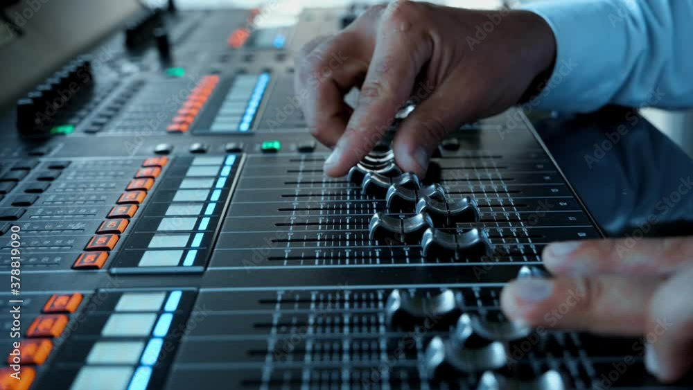 Soundboard Pads On TV Station. Sound Designer Used Digital Audio Mixer In Production Studio. Sound Engineer Moving Sliders In Radio Station.Engineer Press Key Buttons On Control Desk Recording Studio. Soundboard Pads On TV Station. Sound Designer Used Digital Audio Mixer In Production Studio. Sound Engineer Moving Sliders In Radio Station.Engineer Press Key Buttons On Control Desk Recording Studio.