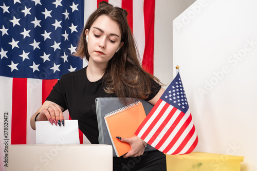 The girl puts the form in t...