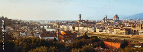 Sunset winter panorama of Florence  Italy  in golden sunlight  with the Arno river and the dome of the cathedral of Santa Maria del Fiore