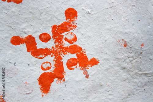 Red swastika symbol on white wall photo