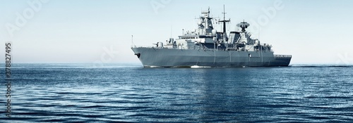 Fényképezés Large grey modern warship sailing in still water