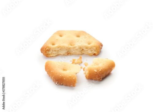 Broken delicious crispy cracker isolated on white