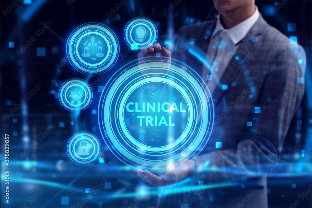 Obraz premium Business, Technology, Internet and network concept. Young businessman working on a virtual screen of the future and sees the inscription: Clinical trial