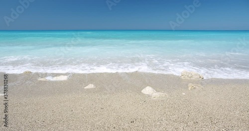 Kathisma Beach, Lefkada Island, Greece. Beautiful waves and blue sea. Summer vacation concept photo