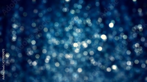 Blue sparkle glitter tinsel with bokeh effect and selective focus. Festive background with bright gold raining lights. Abstract 3D illustration Christmas and New Year's Eve concept texture template.