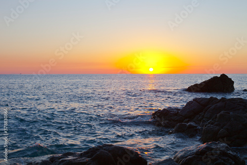 Sunset on the rocky shore. Tyrrhenian Sea.