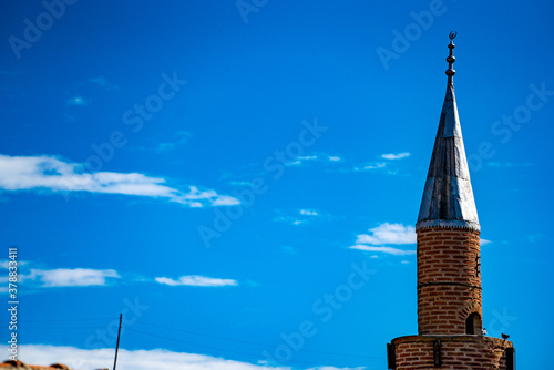 mosque minaret on blue sky background