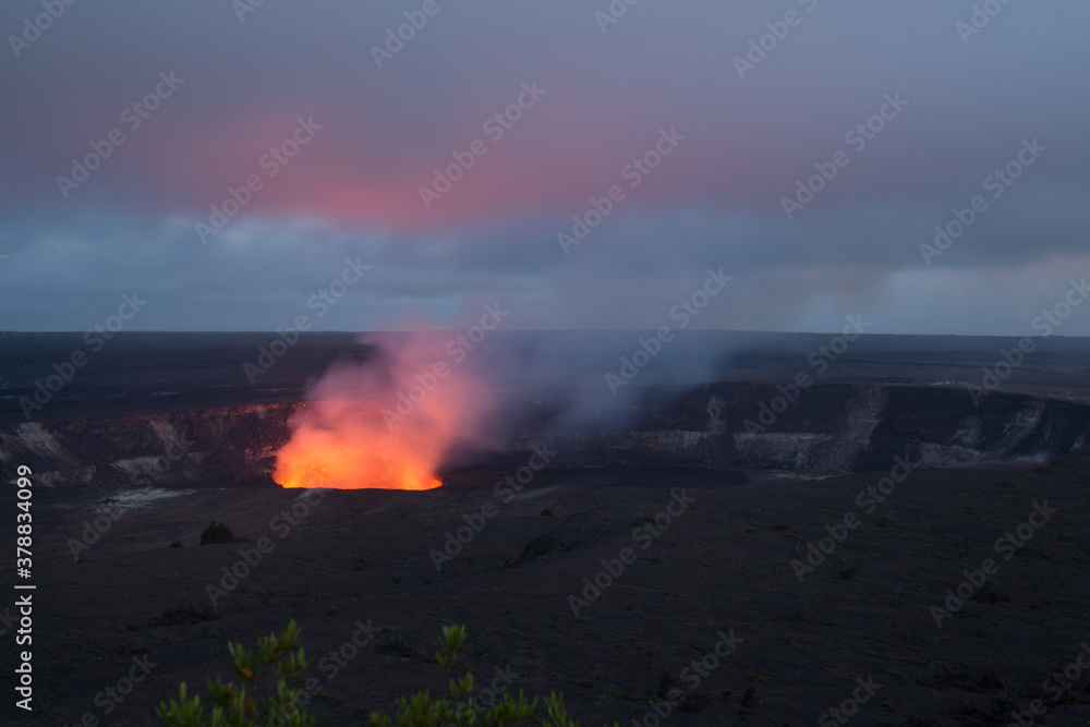 the glow of a volcano at dusk