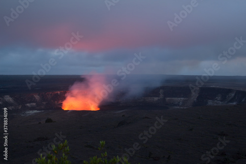 the glow of a volcano at dusk