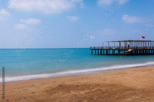 Turkey  Belek. Pier in Mediterranean Sea with long exposure and a blurred background. August 2020