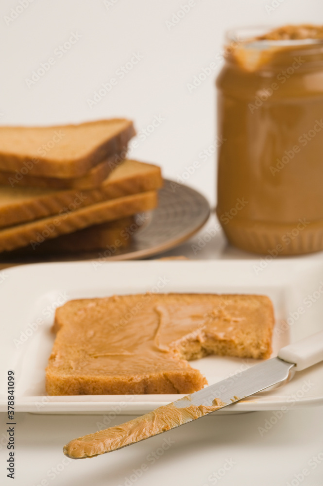 Peanut butter jar with bread slices Peanut butter jar with bread slices