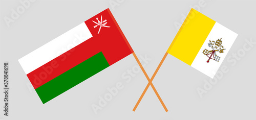 Crossed flags of Vatican and Oman