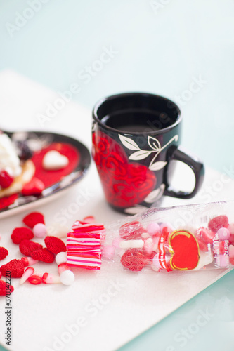 High angle view of a cup of coffee and chocolates
