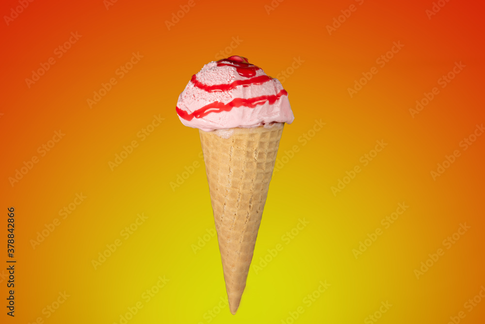 Ice cream cone with strawberry syrup cut out and placed on a yellow and red gradient background. Ice cream cone with strawberry syrup cut out and placed on a yellow and red gradient background.