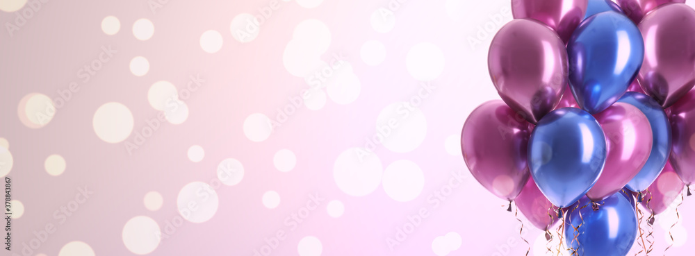 Bright balloons on color background with bokeh effect, space for text. Banner design Bright balloons on color background with bokeh effect, space for text. Banner design