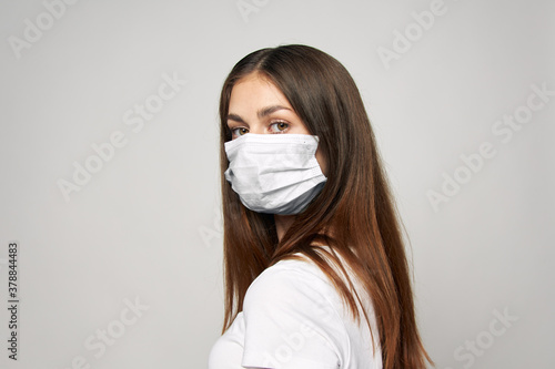 Woman in medical mask Look forward cropped view close-up 