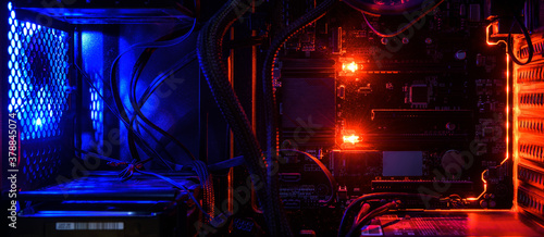 Canvas Print Computer with circuit board and internal LED RGB lights, hardware inside open high performance desktop PC, concept of gaming, technology