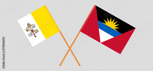 Crossed flags of Vatican and Antigua and Barbuda