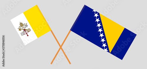 Crossed flags of Vatican and Bosnia and Herzegovina.