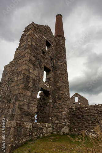 The picturesque ruins of a Cornish tin mine: Carn Galver Mine and engine house, Penwith Peninsula, Cornwall, England, UK.   photo