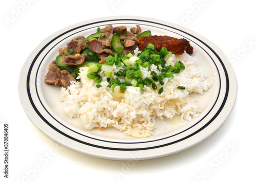 Chicken with rice and vegetables on white background