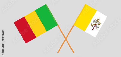 Crossed flags of Vatican and Mali