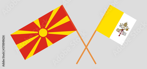 Crossed flags of Vatican and North Macedonia