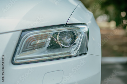 closeup of a white car sidelight in daylight. High quality photo